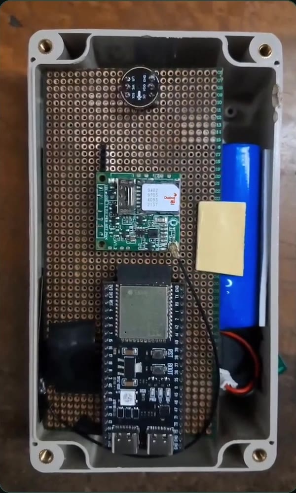 Inside the enclosure: ESP32-S3 board, A7670 4G modem, INMP441 microphone and 18650 battery on perfboard
